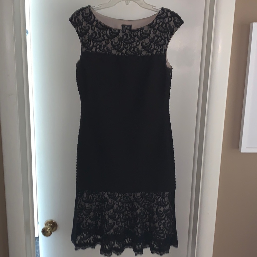 Beautiful, nice fitted black knee length dress. In excellent condition